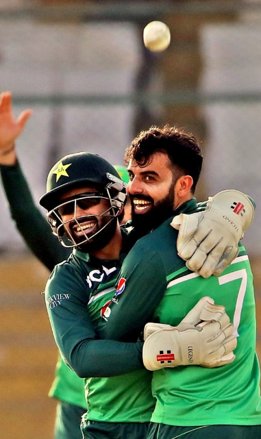 Rizwan hugs Shadab after he takes a wicket